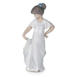 Elegant Porcelain Figurine with Blue Accent